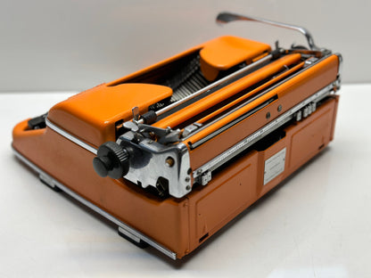 Orange Olympia SM3 Typewriter - QWERTY Keyboard, Fusion of Timeless Aesthetics and Functionality