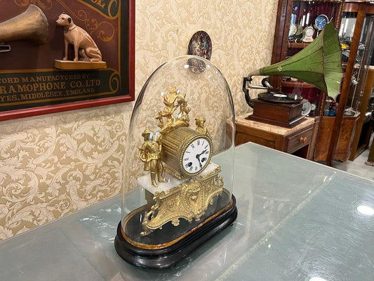 Antique French 1890s Glass-Domed Marquetry Fireplace Clock on display in a vintage setting