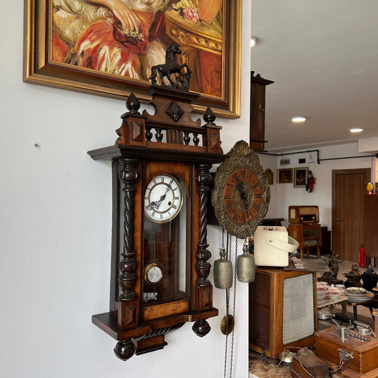 Antique solid wood wall clock in perfect condition displayed in a vintage-themed room.