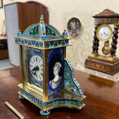 Collectible Antique Enamel Brass Quartz Clock with Intricate Design on Wooden Table in Perfect Condition