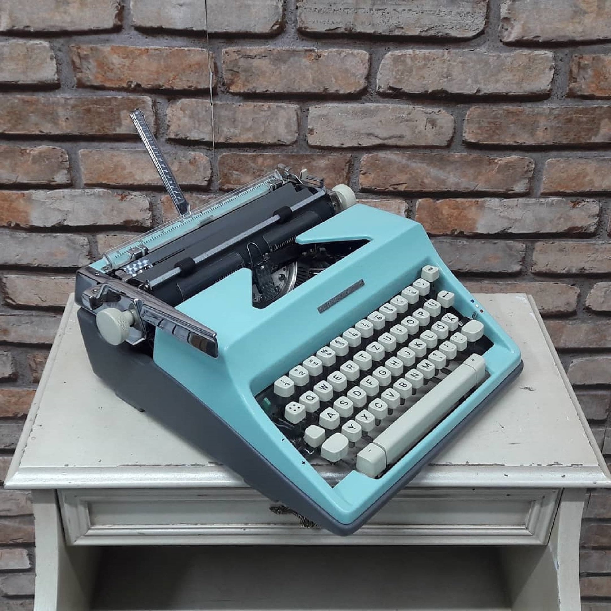 The classic yet vibrant Olympia Colortip 5 Typewriter - A timeless writing companion for the creative mind. Ideal thoughtful gift