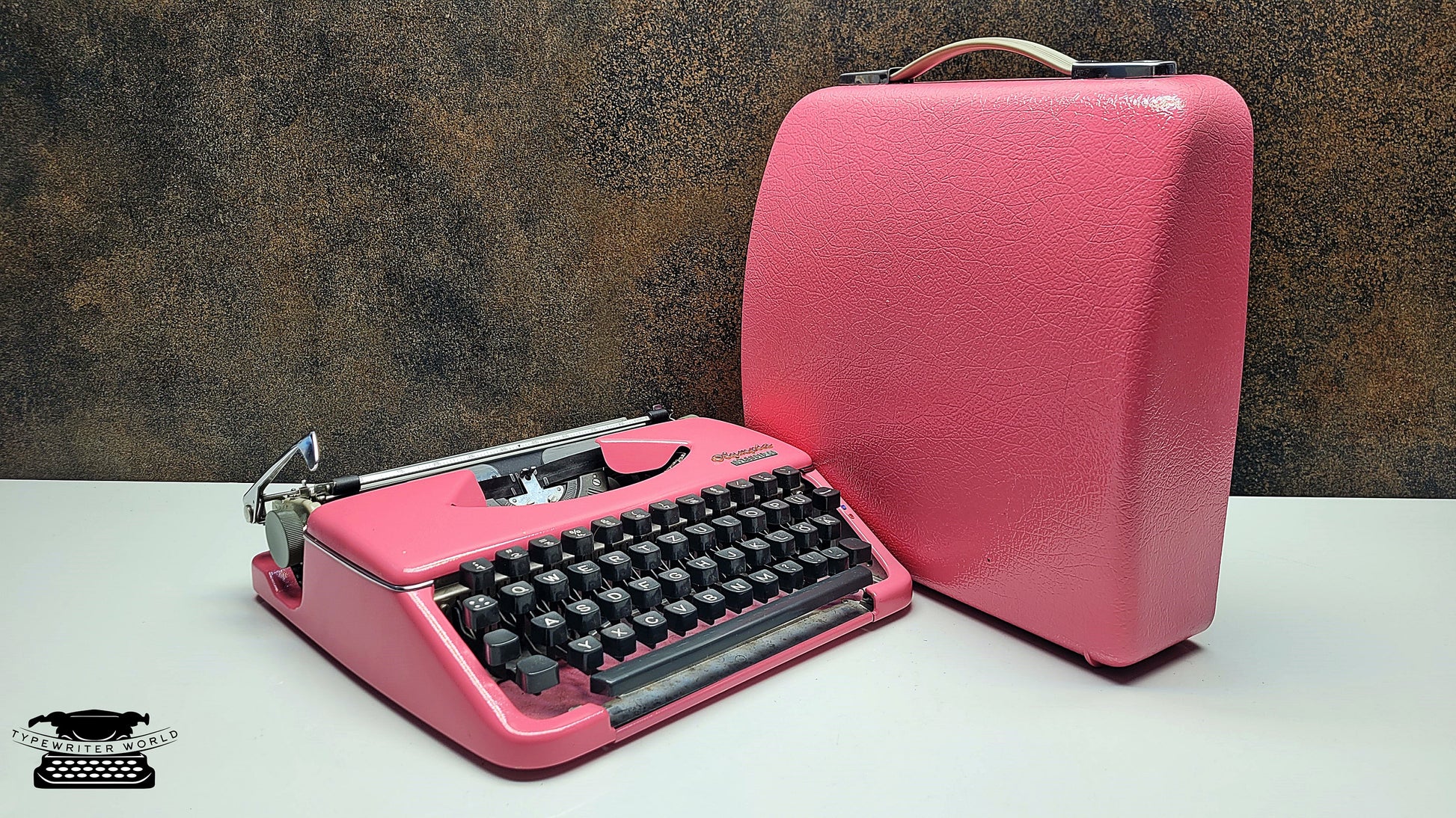 Portable Olympia Splendid 33/66 Vintage Pink Typewriter with Black Keyboard - Ideal for Traveling Writers and Students